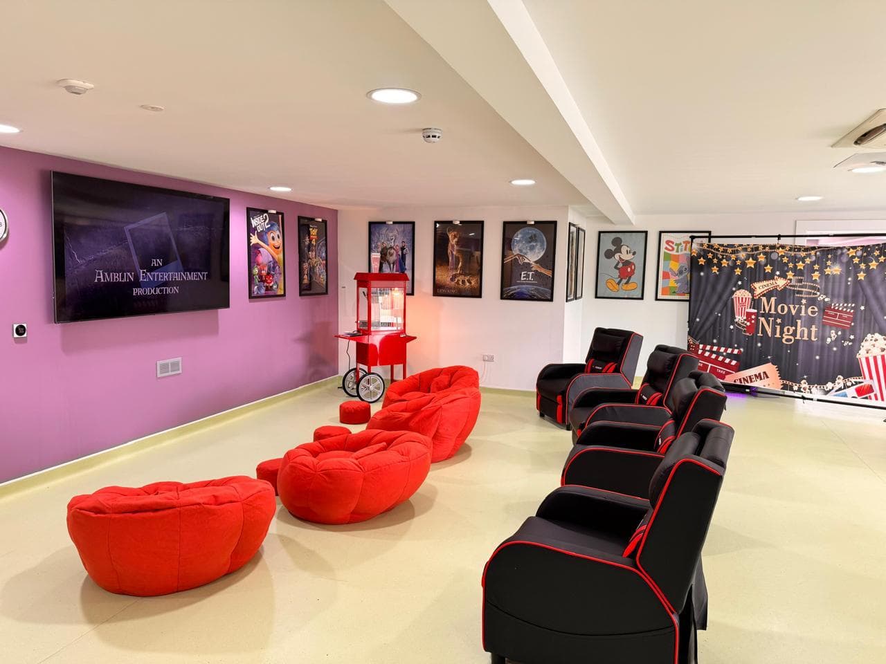 Cinema room with large screen and motion seats